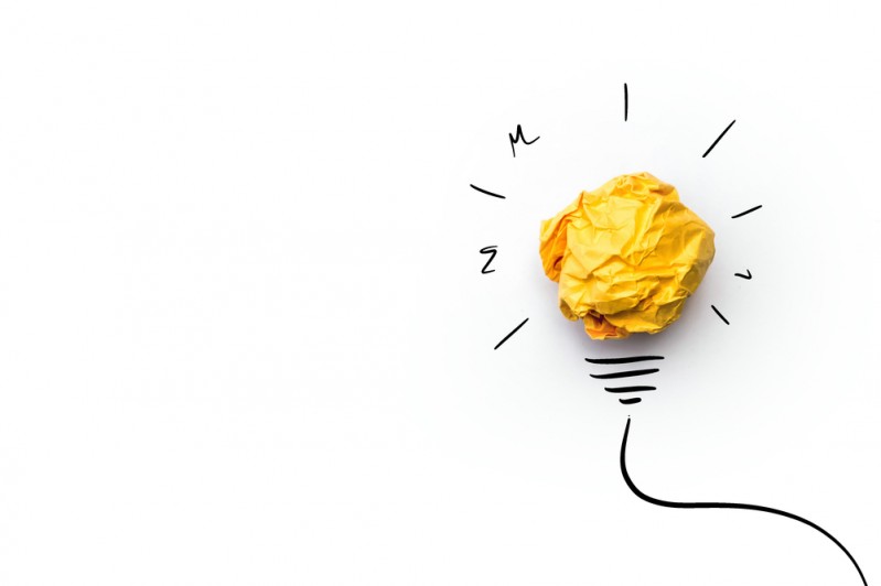 Concept of creativity with crushed paper ball as light bulb