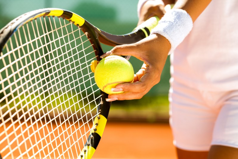 Elite tennis player preparing to serve