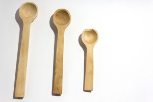3 different size wooden spoons concept of learning curation