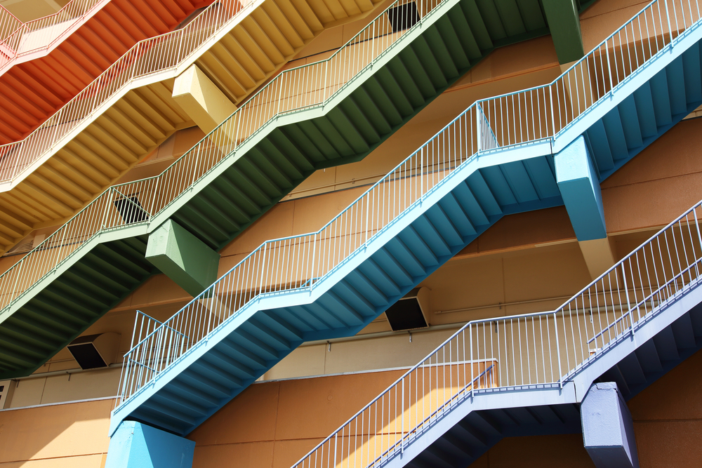 A series of coloured staircases representing the challenge of accessible colour design