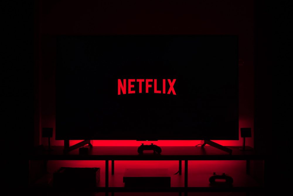 Netflix logo on a television screen surrounded by red light