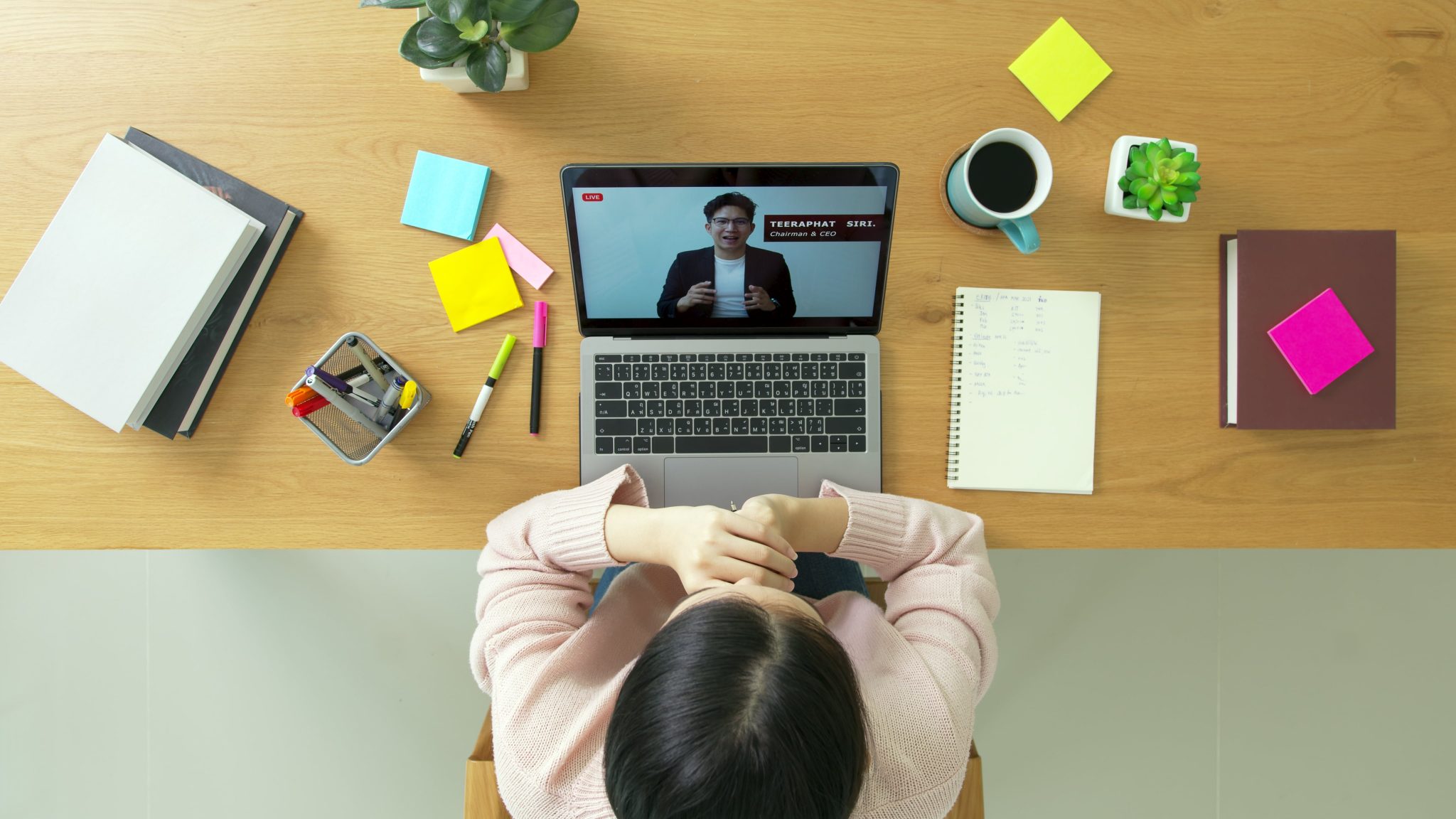 Woman viewing laptop with compliance training on screen