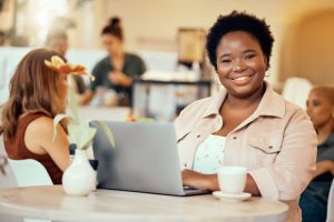 black-woman-portrait-and-laptop-in-cafe-of-remote